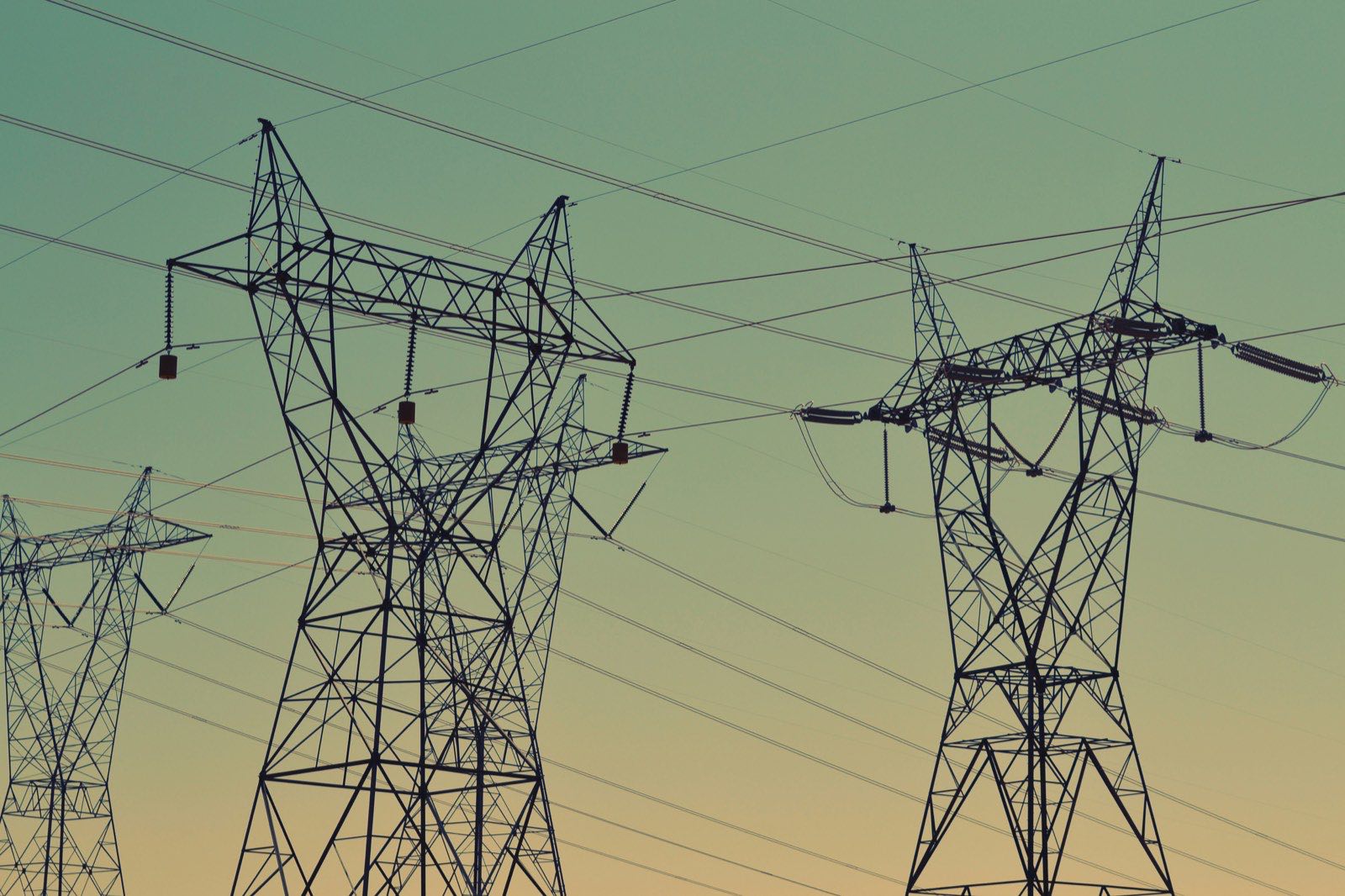 Electricity transmission pylons against a South African sky