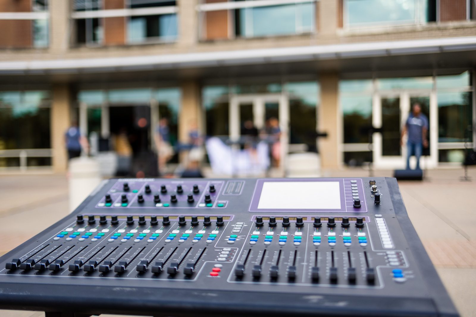 Digital audio mixing console set up at an outdoor event