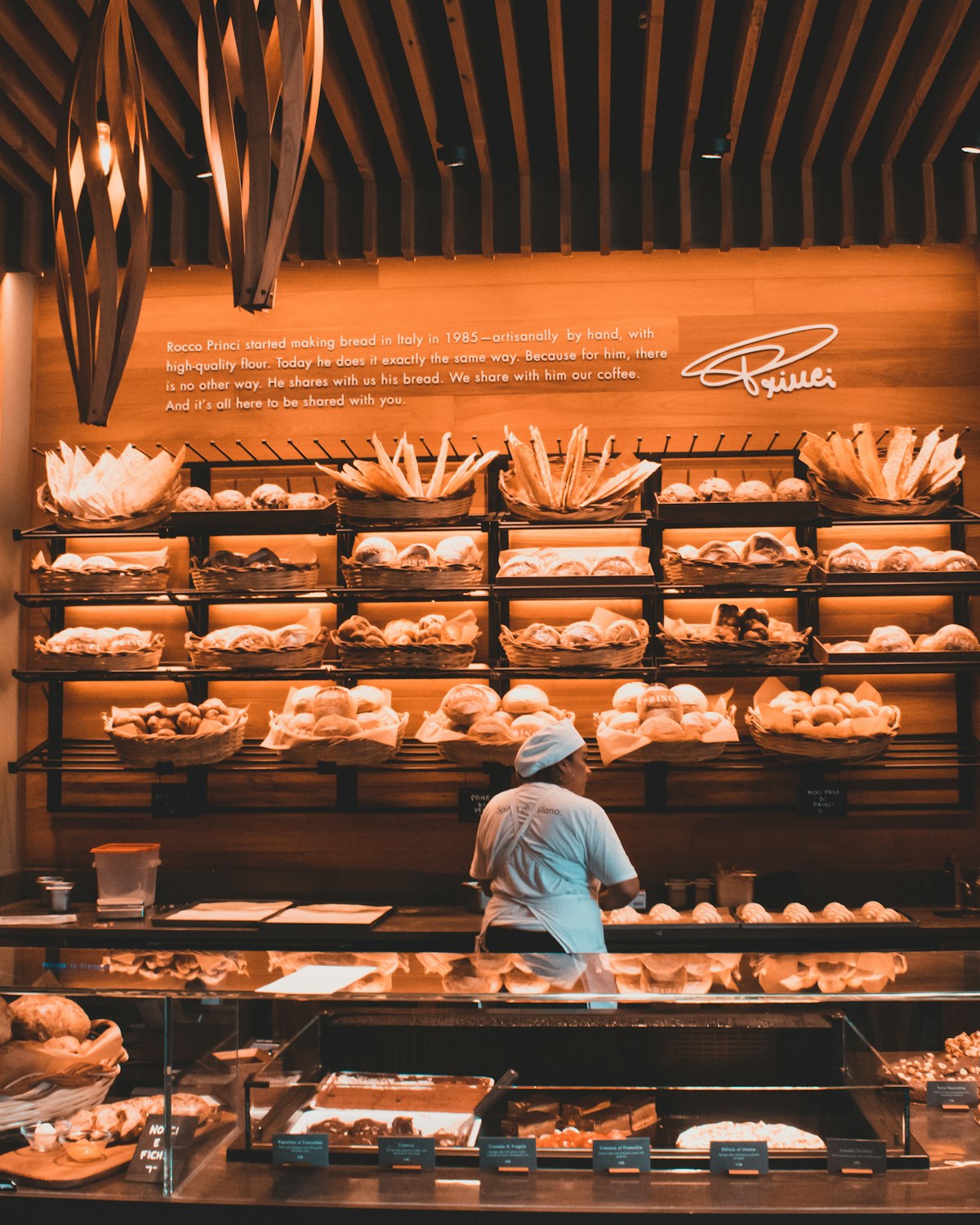 Bakery owner taking orders at the counter