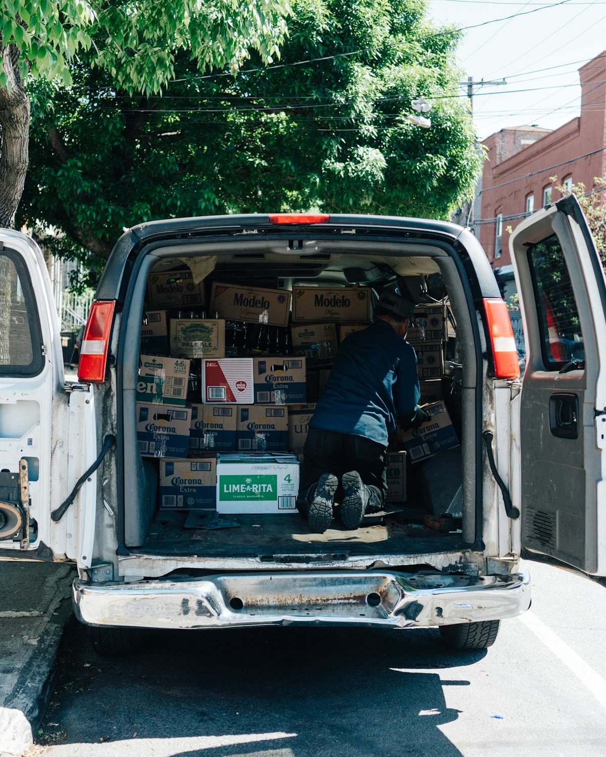 Plumber loading a service van